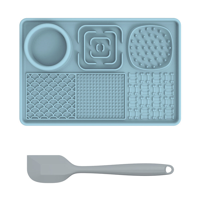 PawBeing Dog and Cat Lick Mat for slow feeding, anxiety relief, and healthy eating, shown with pet treats on the textured surface.