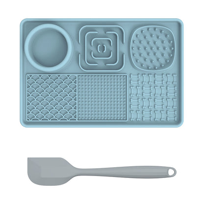 PawBeing Dog and Cat Lick Mat for slow feeding, anxiety relief, and healthy eating, shown with pet treats on the textured surface.